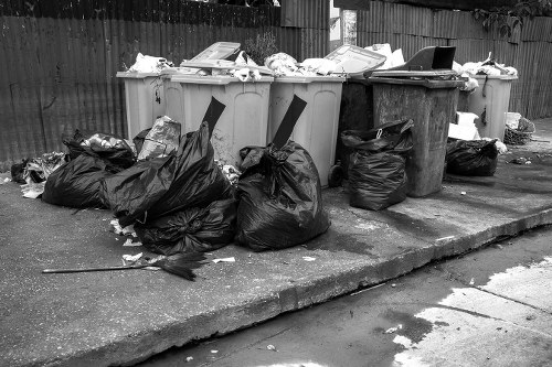 Professional team clearing a cluttered garage in Uxbridge