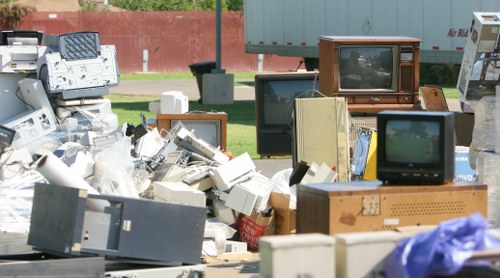 Workers managing construction debris